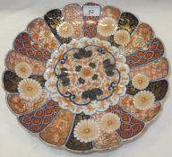 A Japanese Imari shallow dish with scalloped edge