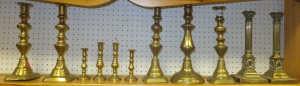 Three pairs of brass candlesticks various, a single candlestick,