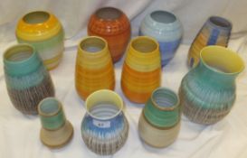 A collection of Shelley pottery vases with dripware and ringed decoration, to include a pair of