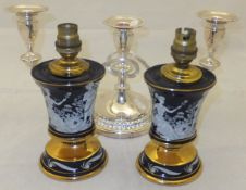 A pair of small Italian table lamp bases decorated in the classical taste,