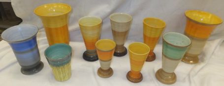 A collection of Shelley pottery wares, to include a pair of vases with graduated banding in orange,