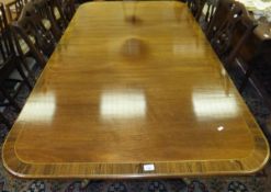 A 20th Century mahogany dining table,