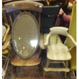 An early 20th Century carver stick back kitchen chair, an oval wall mirror, a child's high chair,