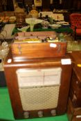 A Victorian mahogany cased brass monocular microscope, a wooden cased HMV radio,