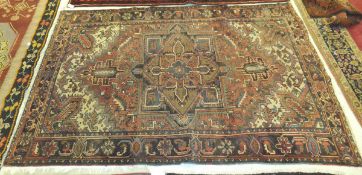 A Heriz carpet, the central madder,