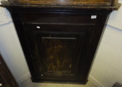 A 19th Century stained pine hanging corner cupboard