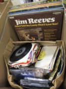 A box containing assorted LP's and CD's to include The Bangles "Everything", Jim Reeves,