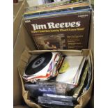 A box containing assorted LP's and CD's to include The Bangles "Everything", Jim Reeves,