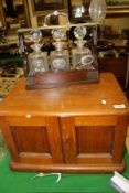 A circa 1900 oak two door canteen cabinet,