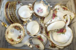 A box containing a collection of Royal Albert "Old Country Roses" pattern teawares to include