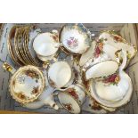 A box containing a collection of Royal Albert "Old Country Roses" pattern teawares to include