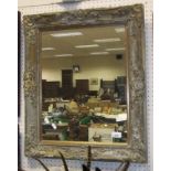 A rectangular giltwood and gesso framed wall mirror