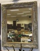 A rectangular giltwood and gesso framed wall mirror