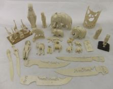 A collection of early 20th Century carved ivory African figures to include elephants, other animals,