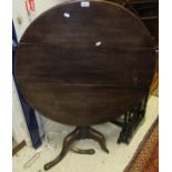 An 18th /19th Century oak circular tilt top table on turned pedestal to tripod base and splayed