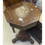 A mahogany and inlaid octagonal work table on associated barley-twist pedestal to carved tripod