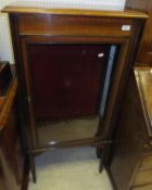 A cross banded mahogany single door glazed cabinet