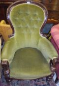 A 19th Century mahogany framed spoon button back salon chair with green velvet upholstery