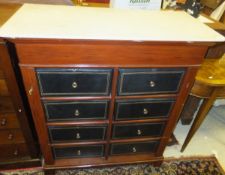An early 20th Century French Wellington style chest of two banks of four drawers
