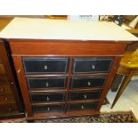 An early 20th Century French Wellington style chest of two banks of four drawers