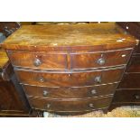 An early Victorian mahogany bow fronted chest of two short and three long graduated drawers on