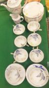 A set of 10 Copenhagen "Iris" decorated cups and saucers,