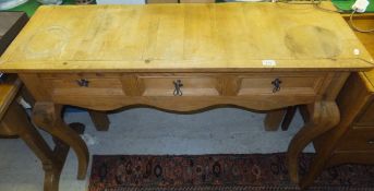 A pine three drawer hall table