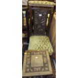 A circa 1900 carved oak nursing chair with Art Nouveau style back panel,