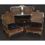 A 19th Century Chinoiserie lacquered and gilt decorated bergere suite comprising settee and two