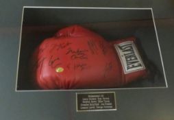 An Everlast boxing glove with signatures - Mohammed Ali, Mike Tyson, Evander Hollyfield,