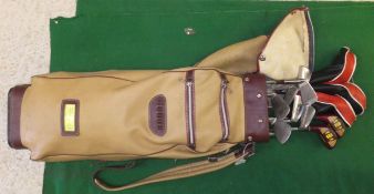 A bag of golf clubs to include examples by Renown