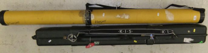 A Kis extending protective rod carrier and another yellow example