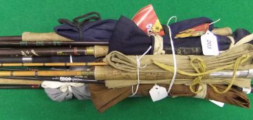 A collection of assorted fishing rods to include a Roy Bailey three piece carbon fly rod,