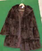 A brown mink three quarter length coat,