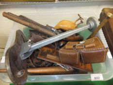 A box containing various sporting requisites, including hunting horns, ammunition pouch,