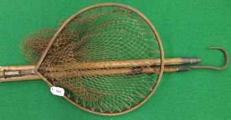 A bentwood teardrop shaped folding landing net with bamboo shaft,