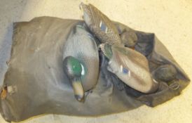 A bag containing various decoy ducks