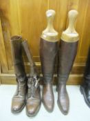 A pair of brown field boots, together with a pair of ladies brown riding boots with trees