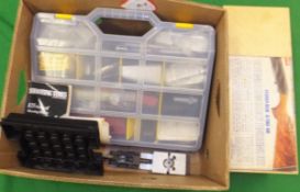 A box containing various shooting requisites,
