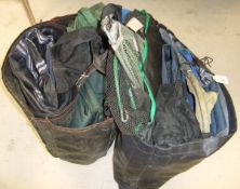 Two fisherman's carryalls containing a large quantity of rod holdalls, tackle bags,