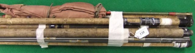 A collection of vintage fishing rods to include examples by Shakespeare,