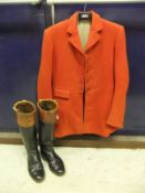 A red hunting coat, together with a pair of black and brown topped riding boots CONDITION REPORTS