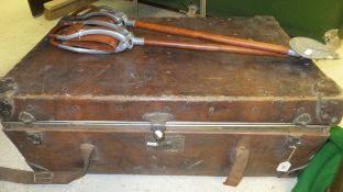 A vintage leather suitcase with fitted interior containing two leather bound Gamebird shooting