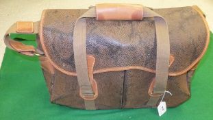 A leather and canvas bound bag by The Regent Belt Company,