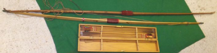 A vintage longbow (spliced), together with a further Slazenger longbow and a boxed box of arrows