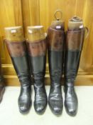 Two pairs of black and tan leather riding boots, both with wooden trees CONDITION REPORTS Both pairs