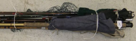 A collection of fishing rods to include two trout fly rods, a fibreglass match rod,