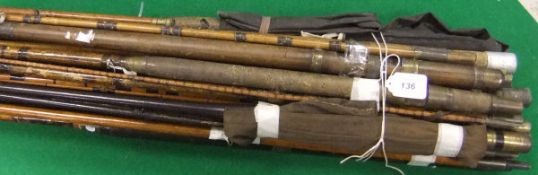 A collection of vintage fishing rods including examples in greenheart,