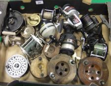 A collection of 18 assorted fishing reels to include two wooden Scarborough reels,