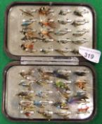 A Hardy "Neroda" fly case with metal clips and a collection of hand tied salmon flies